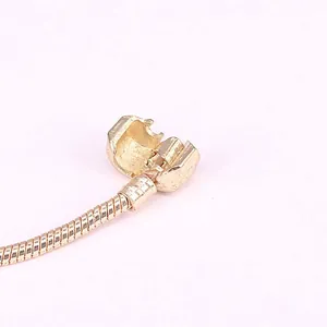 3mm gold snake chain bracelet with barrel clasp shown in close-up detail view