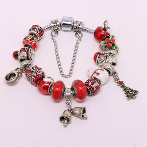Christmas charm bracelet with red and green enamel pendants on a silver metal chain