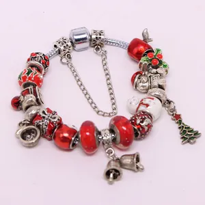 Christmas charm bracelet with red glass beads, Santa and tree pendants on silver snake chain