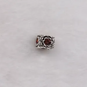 Vintage floral charm bead with red gemstone and oxidized silver finish for bracelets