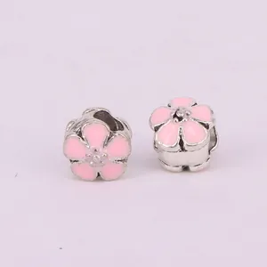Pink enamel flower charms in cherry blossom design for DIY bracelets and jewelry