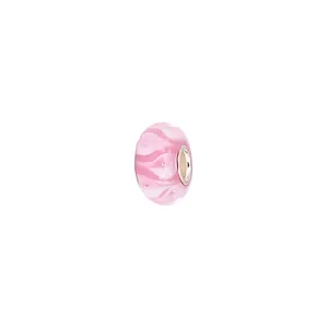 Macro detail of a pink floral glass bead with a silver-plated core for DIY jewelry