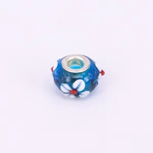 Detailed blue glass bead with white flower patterns and metal core for DIY bracelets