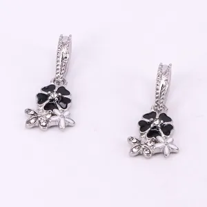 Silver flower pendant with black and white enamel and rhinestones for DIY jewelry
