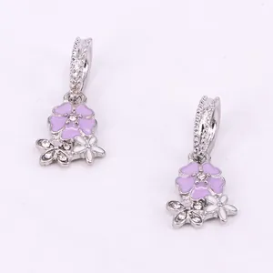 Detail of lavender and white enamel cherry blossom charms with sparkling zircon pavé