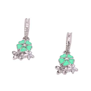 Green and white floral drop earrings with silver metal rhinestones on white background