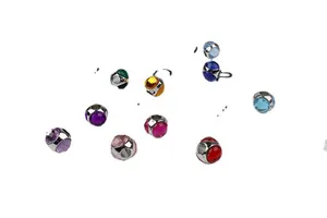 Close-up of colorful faceted crystal charms with silver metal shells for DIY bracelets