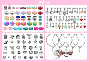 Close-up of DIY jewelry kit with colorful glass beads, silver pendants and 5 snake chain bracelets