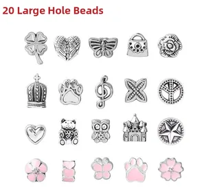 Detail of 20 pieces large hole beads with pink enamel charms like hearts and crowns