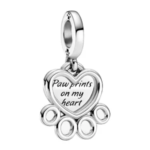 Silver heart charm with paw print design and Paw prints on my heart engraving