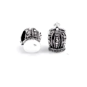 Vintage silver crown charms with intricate cross detail and pearl inlay for jewelry DIY