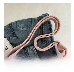 Close-up of pink tote bag showing comfortable leather shoulder strap and fine stitching