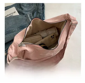 Interior view of large capacity tote bag showing phone, wallet and folding umbrella