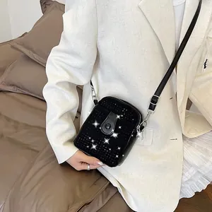 Mini black rhinestone crossbody phone bag with chain strap and silver metal hardware