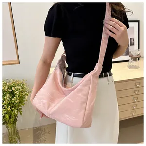 Detailed view of pink tote bag with marble texture worn by model in minimalist setting