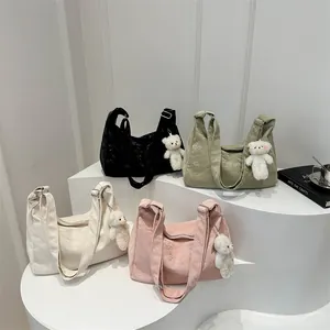 Minimalist pleated tote bags in black, sage green, off-white and pink with bear charm