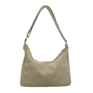 Minimalist beige tote bag in pleated PU leather with silver zipper for daily commute
