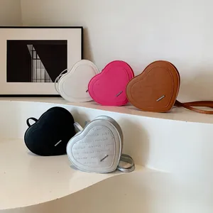 Detailed collection of heart-shaped crossbody bags featuring rich rabbit embossed patterns