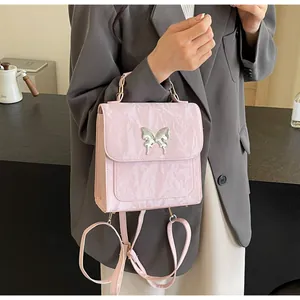 Pink pleated leather backpack featuring a silver butterfly clasp and versatile strap