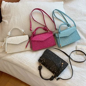 Sparkly glitter mini flap handbags in four colors with knotted handles and slim straps