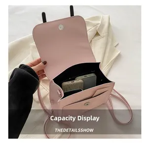 Pink PU leather bag interior detail showing capacity for two smartphones and magnetic flap