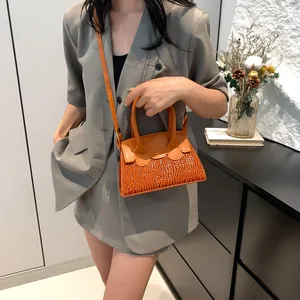 Chic orange faux crocodile embossed crossbody bag for women with elegant top handles