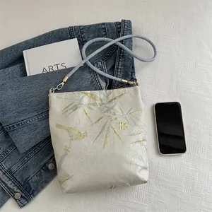 Embroidered large capacity bucket bag with oriental bird and bamboo patterns