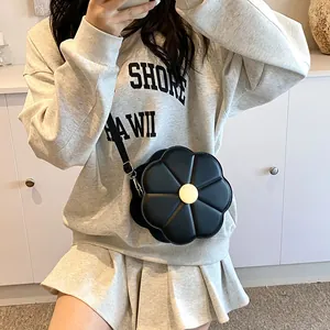 Sac à bandoulière créatif en forme de fleur noire avec centre jaune et sangle en cuir