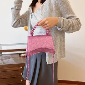 Sac à main rose pailleté avec base incurvée et poignée nouée pour femmes chic