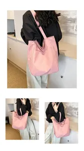 Close-up detail of pink large-capacity Oxford cloth tote bag with reinforced stitching