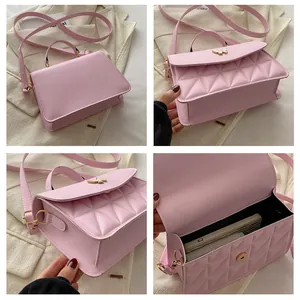 Pink quilted PU leather crossbody bag with butterfly clasp and interior phone pocket