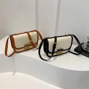 Retro canvas saddle crossbody bag with leather trim and gold buckle closure