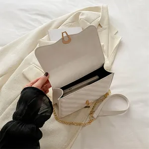 White V-quilted flap crossbody bag with gold chain strap and spacious interior