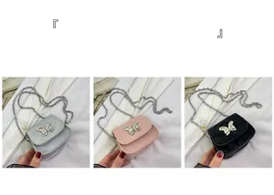 Detailed view of mini crossbody bow bags in silver gray, pink, and black colors