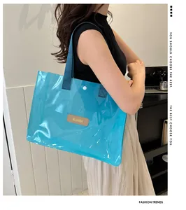 Detail of transparent blue tote bag with MS.HUIXIBAG logo and woven handle strap