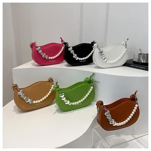Collection of half-moon leather handbags with pearl heart chains in six vibrant colors
