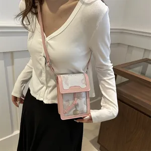 Floral crossbody phone bag with pink leather trim and elegant jacquard pattern for women