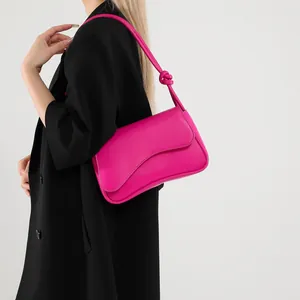French style vibrant pink leather underarm bag with unique wavy flap and knotted shoulder strap