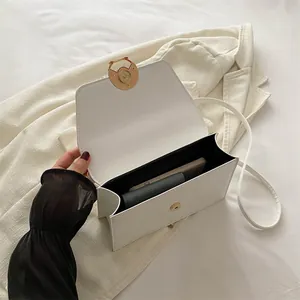 White PU leather small square crossbody bag with round metal buckle and internal phone storage