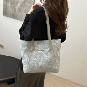Chic silver marble pattern tote bag with gold metal details and slim shoulder straps