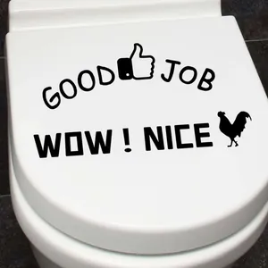 Detail view of black Good Job and thumb up wall sticker on a white toilet lid