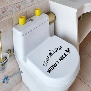 Detail of Good Job and Wow Nice waterproof wall stickers applied on a toilet lid