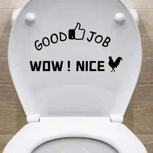 Good Job & Wow Nice black vinyl wall stickers on white toilet lid in a bathroom