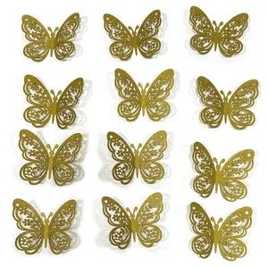 Detailed view of 12 gold glitter 3D butterfly wall stickers with intricate laser cutouts
