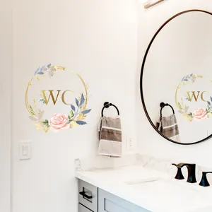 Floral WC wall sticker featuring pink roses and gold lettering for bathroom mirrors