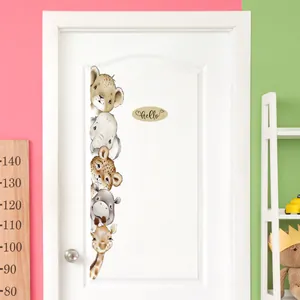 Vertical arrangement of cute safari animals like lions and giraffes on a white nursery door