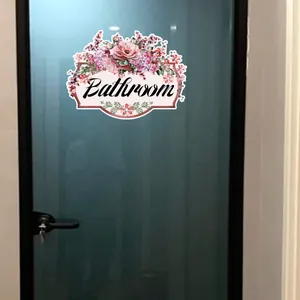 Floral bathroom door sticker featuring pink roses and elegant cursive text on glass
