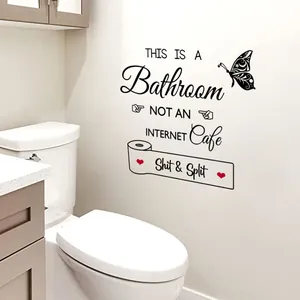 Dettaglio dell'adesivo murale creativo per bagno con farfalle e testo umoristico sul muro