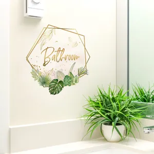 Self-adhesive bathroom wall sticker with gold hex frame, green leaves and lettering