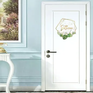 Detail of Bathroom wall sticker with gold geometric frame and tropical green leaves